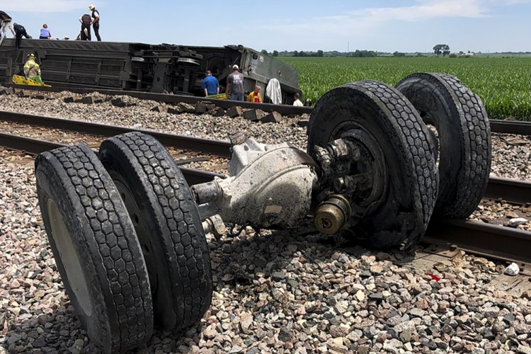Debris sits near railroad tracks after an Amtrak passenger train derailed Monday near Mendon, Mo. The Southwest Chief, traveling from Los Angeles to Chicago, was carrying about 243 passengers when it collided with a dump truck near Mendon, Amtrak spokeswoman Kimberly Woods said.