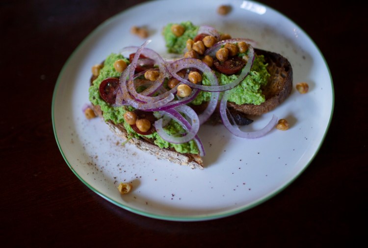 Is pea mash the new (Maine-sustainable) avocado toast? Here: Pea mash accented with ras el hanout on toast with cherry tomatoes, red onions, baked chickpeas and sumac. 