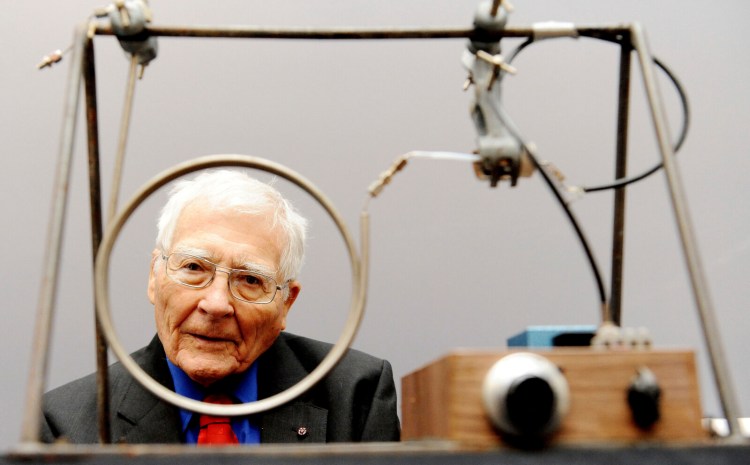 Scientist and inventor James Lovelock, 94, poses with one of his early inventions, a homemade Gas Chromatography device, used for measuring gas and molecules present in the atmosphere, during a photocall for the Unlocking Lovelock: Scientist, Inventor, Maverick exhibition at the Science Museum, south west London.