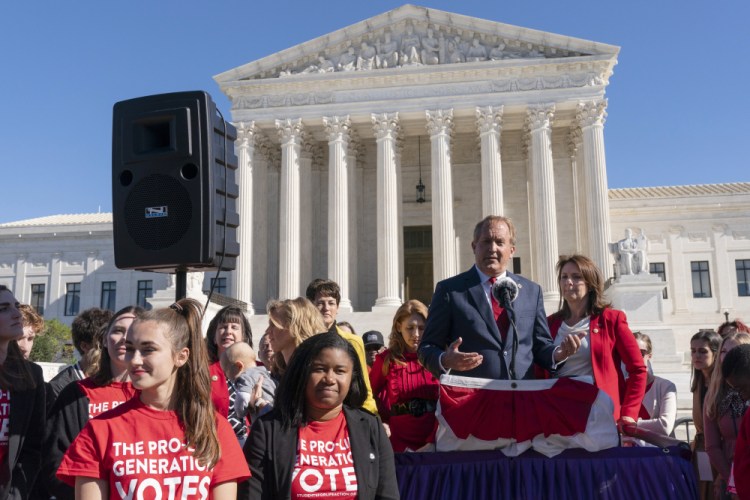 Texas Attorney General Ken Paxton addresses anti-abortion activists at a rally outside the Supreme Court, on Nov. 1, 2021, after hearing arguments on abortion in the court.