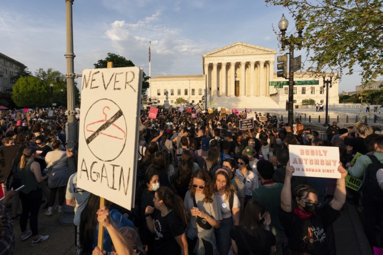 Demonstrators protest outside of the U.S. Supreme Court on May 3 following news of the leaked draft opinion suggesting justices would overturn the landmark 1973 Roe v. Wade case that legalized abortion nationwide.