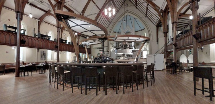 The interior of Chestnut Street Church, looking past the circular bar toward the open kitchen in the rear of the former nave.