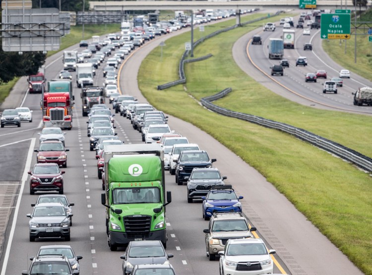 Traffic builds along Interstate 4 in Tampa, Fla., on Tuesday as Hurricane Ian approaches. The storm could strike the area as soon as late Wednesday.