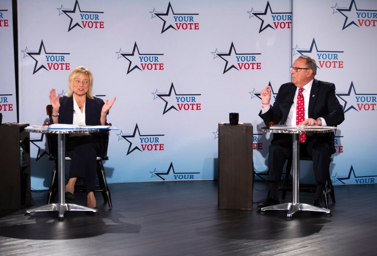 Gov. Janet Mills, and former Gov. Paul LePage argue during the debate on Tuesday.