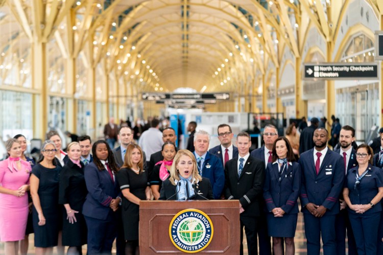 Association of Flight Attendants-CWA International President Sara Nelson, accompanied by flight attendants, speaks at a news conference to announce longer rest times for flight attendants between shifts at Washington National Airport in Arlington, Va., on Tuesday. 