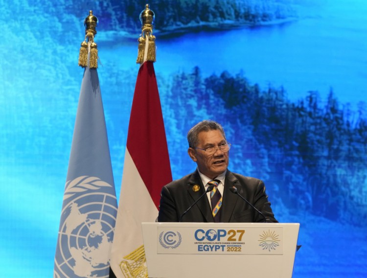 Kausea Natano, prime minister of South Pacific island Tuvalu, speaks at the COP27 U.N. Climate Summit on Tuesday in Sharm el-Sheikh, Egypt. He said the world needs to prioritize "fast-acting strategies" because there isn't time to slow or reverse the damage already done by climate change. 