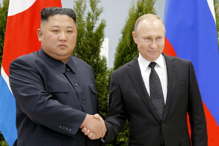 Russian President Vladimir Putin, right, and North Korea's leader Kim Jong Un shake hands during their meeting in Vladivostok, Russia on April 25, 2019. In September, U.S. officials confirmed Russia was in the process of purchasing  rockets and artillery shells from North Korea. 