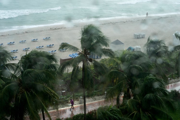 Rain deterred beachgoers in Miami on Tuesday as Tropical Storm Nicole approaches. Some counties are opening shelters, but evacuation order are not expected.
