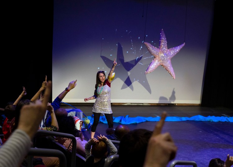 Allison McCall, the theatre company coordinator at the Children’s Museum & Theatre of Maine, counts down the sea star drop at last year's New Year's Eve celebration. 