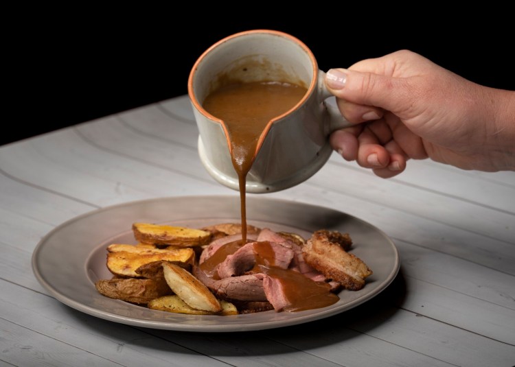 Serve the Salt Pork Eye of the Round with roasted potatoes and gravy. 