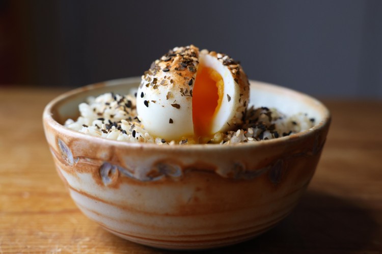 A soft-boiled egg on brown rice seasoned with Ocean's Balance spicy furikake sprinkle. Furikake is made from dried fish flakes, sesame seeds, salt, sugar and chopped seaweed. Maine is at the cutting edge of the U.S. seaweed industry. 
