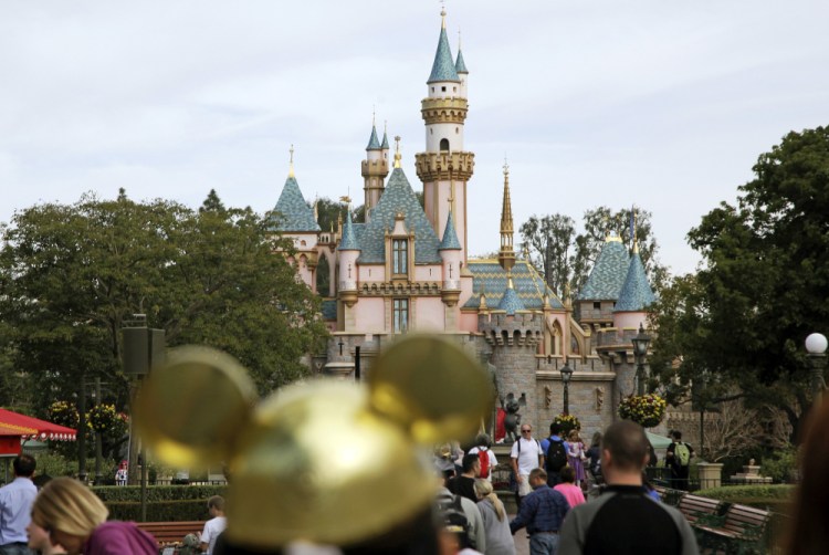 Visitors walk toward Sleeping Beauty's Castle at Disneyland Resort in Anaheim, Calif., in 2015. Jae C. Hong/Associated Press, file