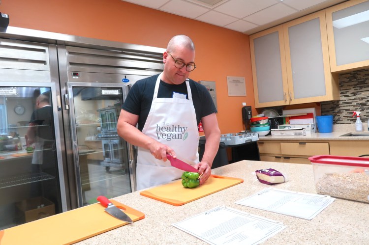 Maine cookbook author Colin McCullough in the classroom kitchen at the Peter Alfond Prevention & Healthy Living Center at MaineGeneral Medical Center in Augusta, where he is teaching a new series of vegan cooking classes. 
