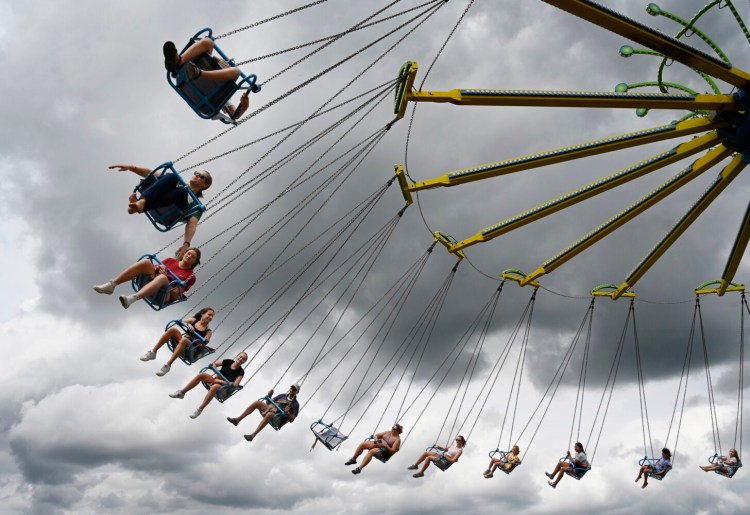 The YoYo ride spins visitors through the sky at the Topsham Fair last year.