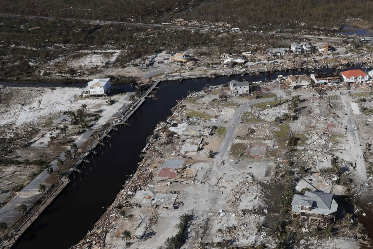Devastation from Hurricane Michael is visible including the area around Bonny Paulson's home, center top, in Mexico Beach, Fla., on Oct. 12, 2018. Gerald Herbert/Associated Press file