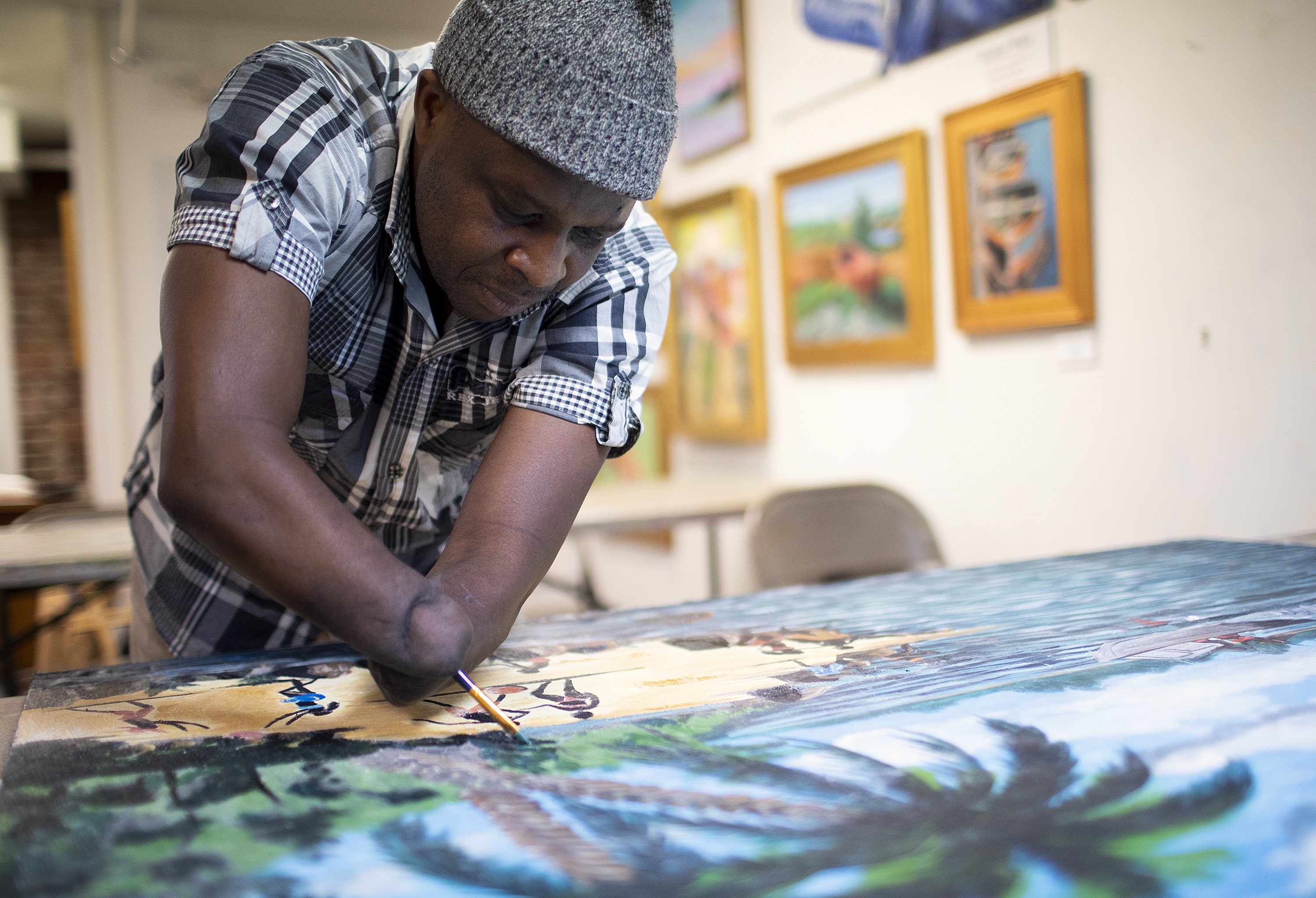 For Rwandan artist who lost his hands in an attack, painting leads to  healing and hope