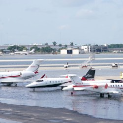Small planes are parked at Fort Lauderdale- Hollywood International Airport, after the airport was force to shut down due to flooding, Thursday, April 13, 2023, in Fort Lauderdale, Fla. It's been a rainfall tale of two states in Florida this year, where the southeast coast has been inundated by sometimes-record rainfall and much of the Gulf coast is dry as a bone.
