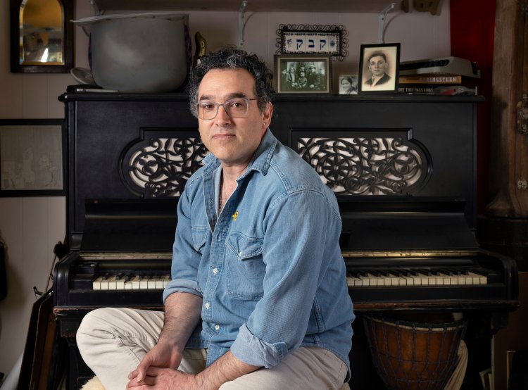  Russell Kaback of South Portland, at his home studio, will perform a solo musical show based on his grandfather's experiences during the Holocaust. 